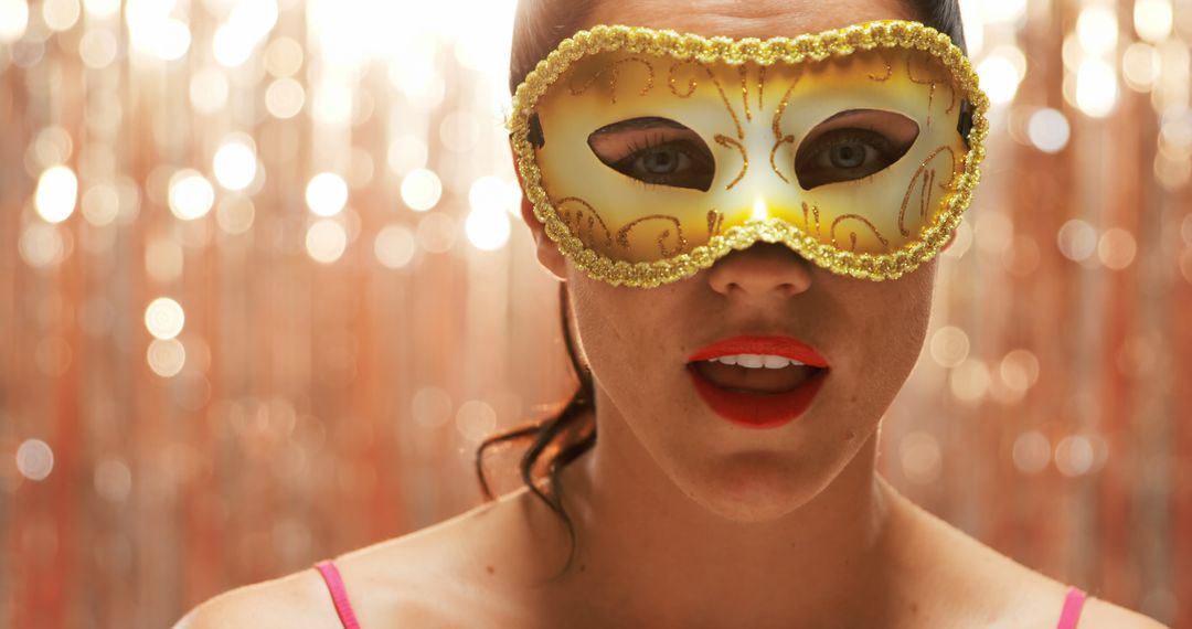 Woman Wearing Golden Masquerade Eye Mask in Festive Setting - Free Images, Stock Photos and Pictures on Pikwizard.com