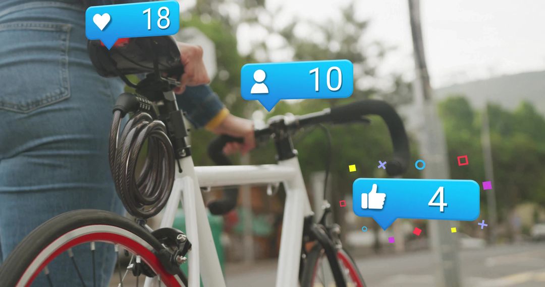 Cyclist Engaging with Social Media Icons in Urban Environment