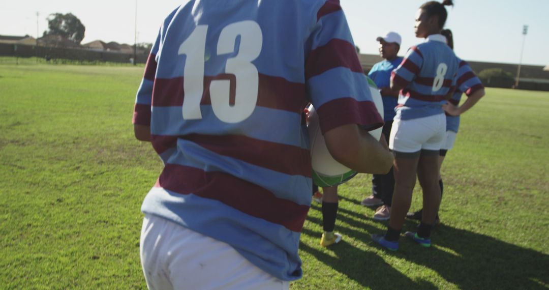 Female Rugby Team Discussing Strategy on Field - Free Images, Stock Photos and Pictures on Pikwizard.com