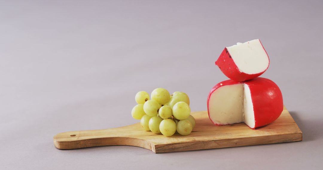 Cheese with Grapes on Wooden Board - Free Images, Stock Photos and Pictures on Pikwizard.com