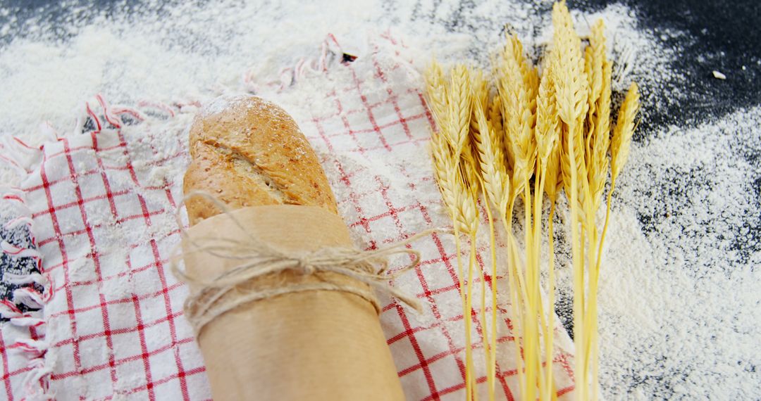 Freshly Baked Bread and Wheat on Flour-Dusted Surface - Free Images, Stock Photos and Pictures on Pikwizard.com