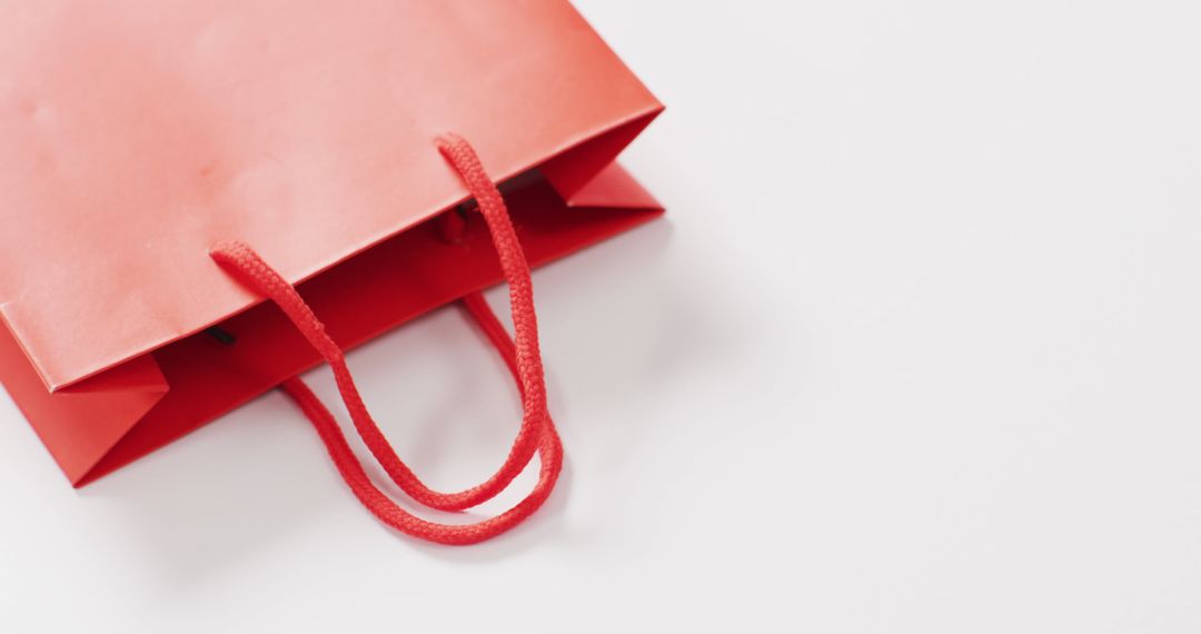 Red Shopping Bag with Handle on White Background - Free Images, Stock Photos and Pictures on Pikwizard.com