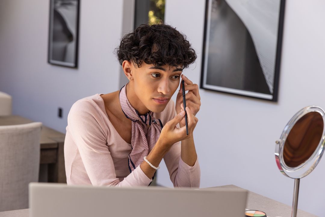 Man Applying Eyebrow Makeup at Modern Home