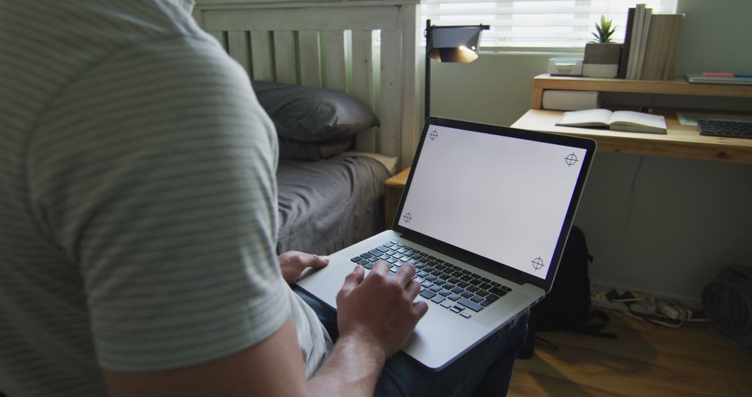 Person Using Laptop on Bed in Cozy Bedroom - Free Images, Stock Photos and Pictures on Pikwizard.com