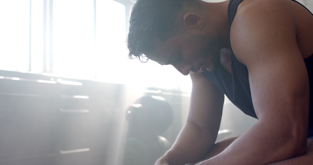 Man Resting after Intense Gym Workout wearing Smartwatch