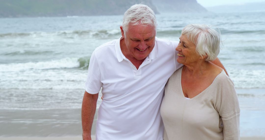 Senior Couple Enjoying Quality Time on Scenic Beach - Free Images, Stock Photos and Pictures on Pikwizard.com