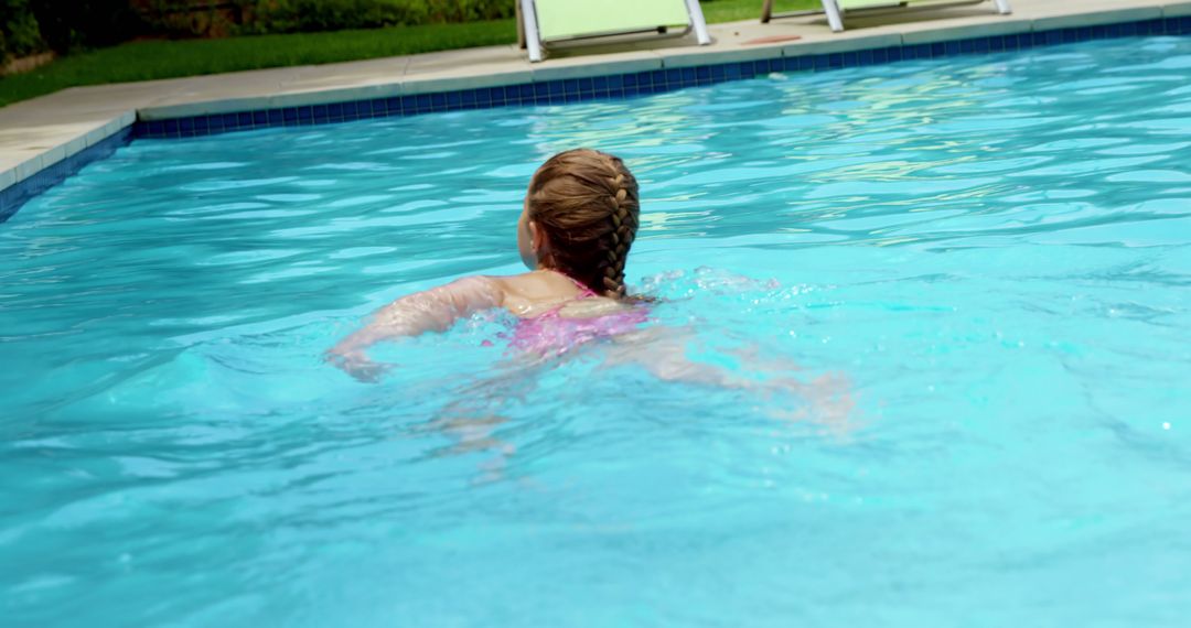 Young Girl Swimming in Refreshing Outdoor Pool - Free Images, Stock Photos and Pictures on Pikwizard.com