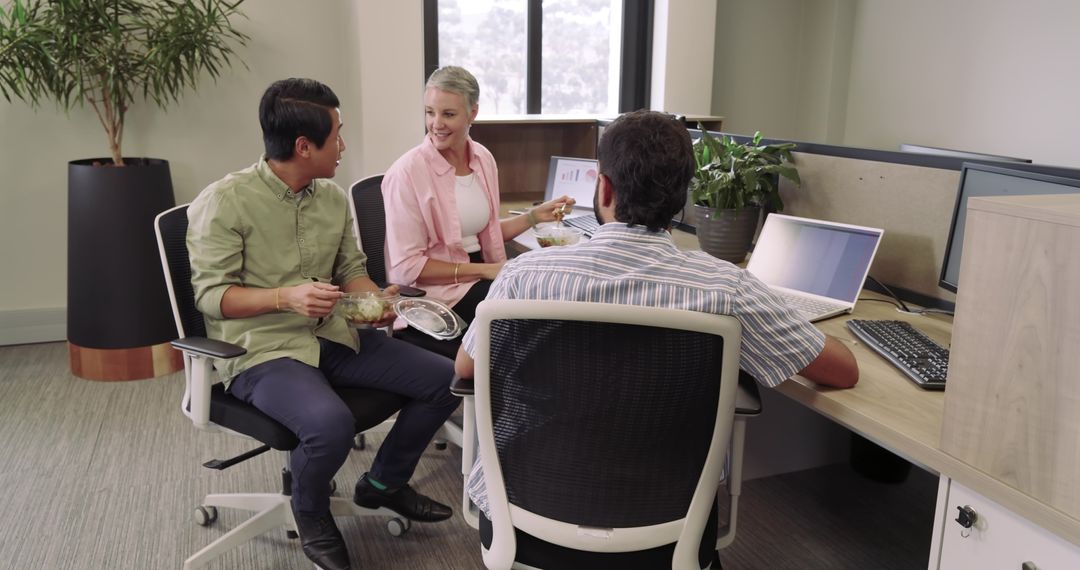 Diverse Team Enjoying Lunch in Modern Office Ambiente