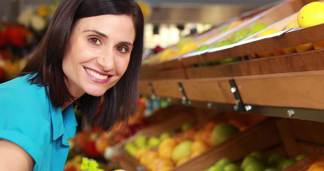 Smiling Woman Choosing Fresh Produce at Grocery Store - Free Images, Stock Photos and Pictures on Pikwizard.com