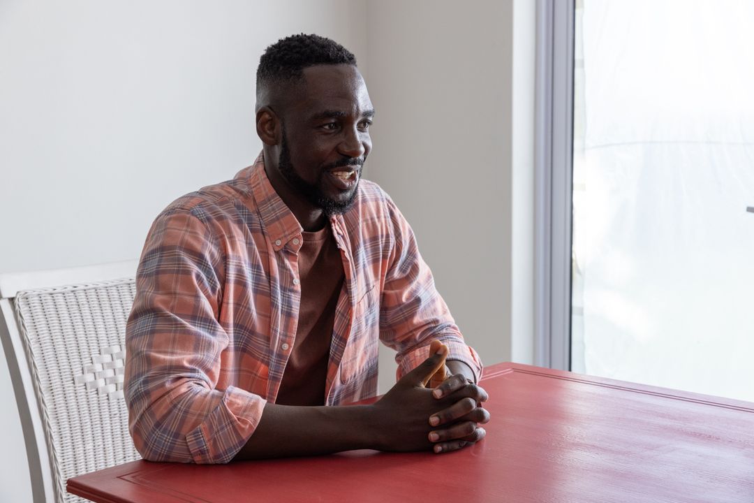 Casual Office Vibe: Man at Red Table