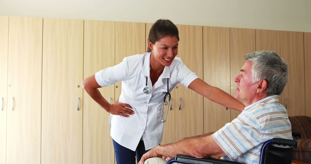 Nurse Caring for Elderly Patient in Wheelchair - Free Images, Stock Photos and Pictures on Pikwizard.com