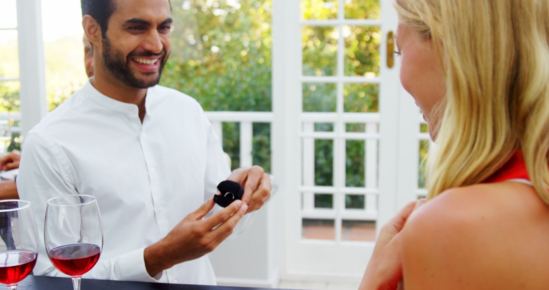 Man Proposing to Excited Woman with Engagement Ring - Free Images, Stock Photos and Pictures on Pikwizard.com