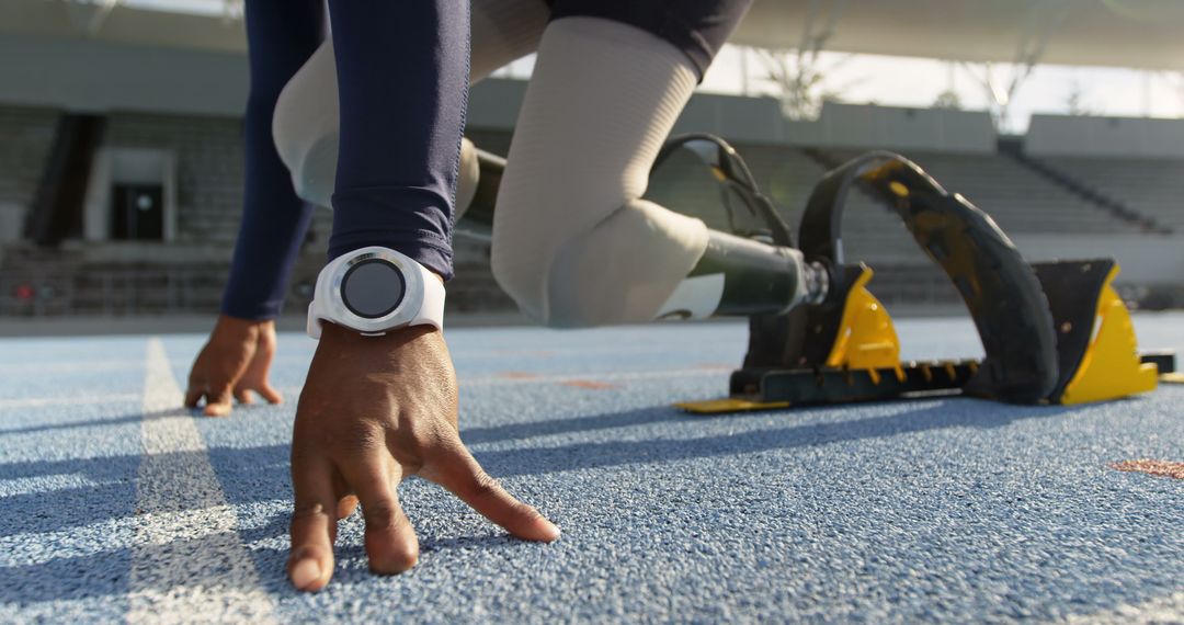 Paralympic Sprinter Wearing Prosthetic Limbs Preparing for Sprint - Free Images, Stock Photos and Pictures on Pikwizard.com