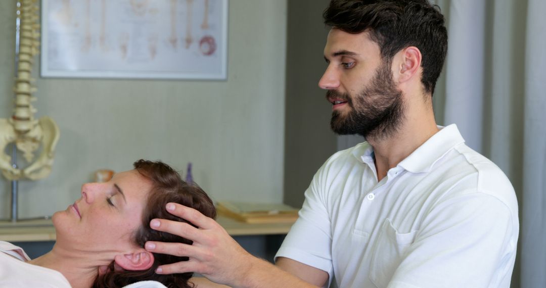 Physiotherapist doing manual therapy on patient's neck - Free Images, Stock Photos and Pictures on Pikwizard.com