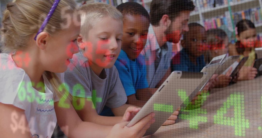 Students with Teacher Using Tablets in Library
