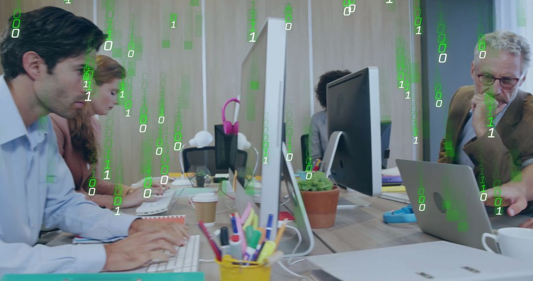 Diverse Team Analyzing Data with Modern Technology in Office