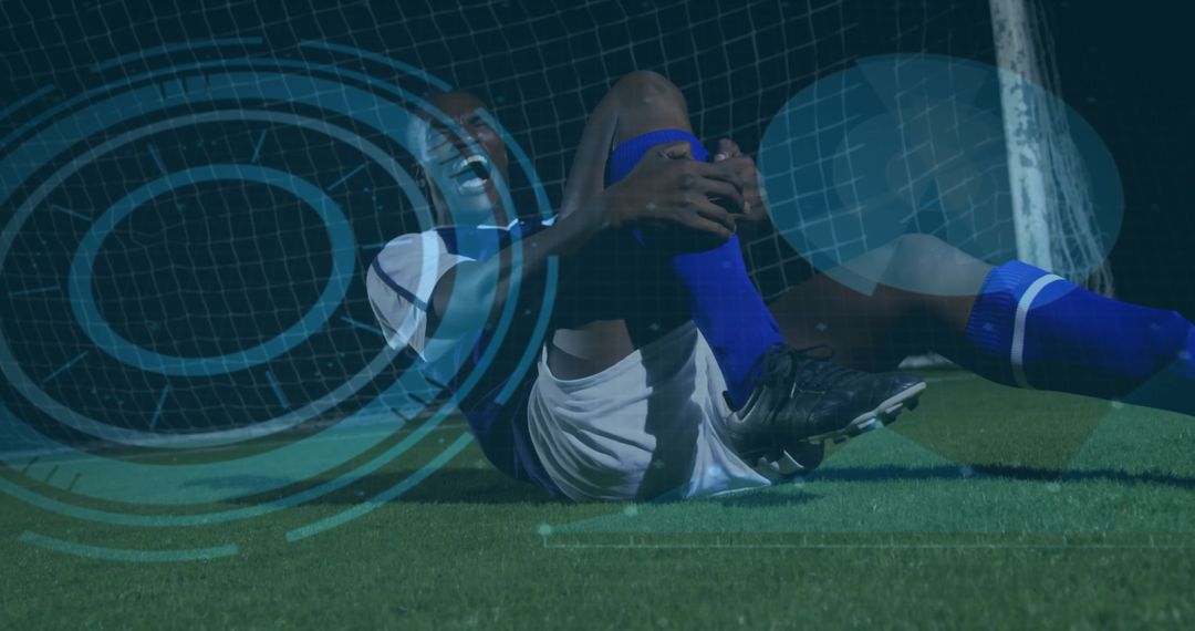 Football Player Kneeling in Pain on Field with Digital Elements