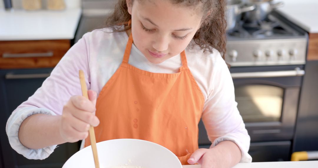 Young Girl Mixing Ingredients in Modern Kitchen - Free Images, Stock Photos and Pictures on Pikwizard.com