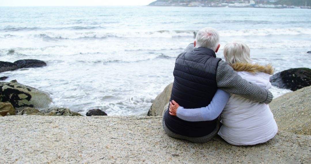 Senior Couple Embracing While Looking at the Ocean - Free Images, Stock Photos and Pictures on Pikwizard.com