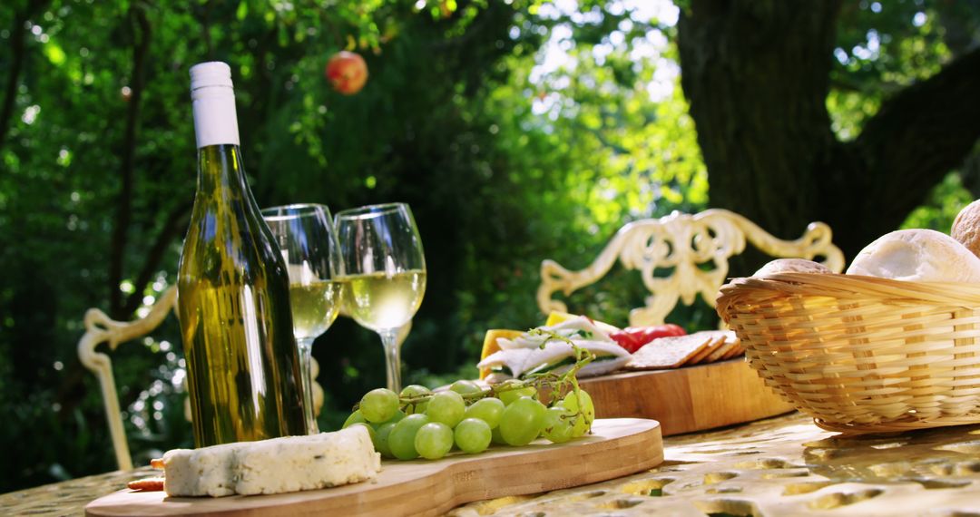 Picnic Table with Wine and Cheese in Beautiful Garden Setting - Free Images, Stock Photos and Pictures on Pikwizard.com