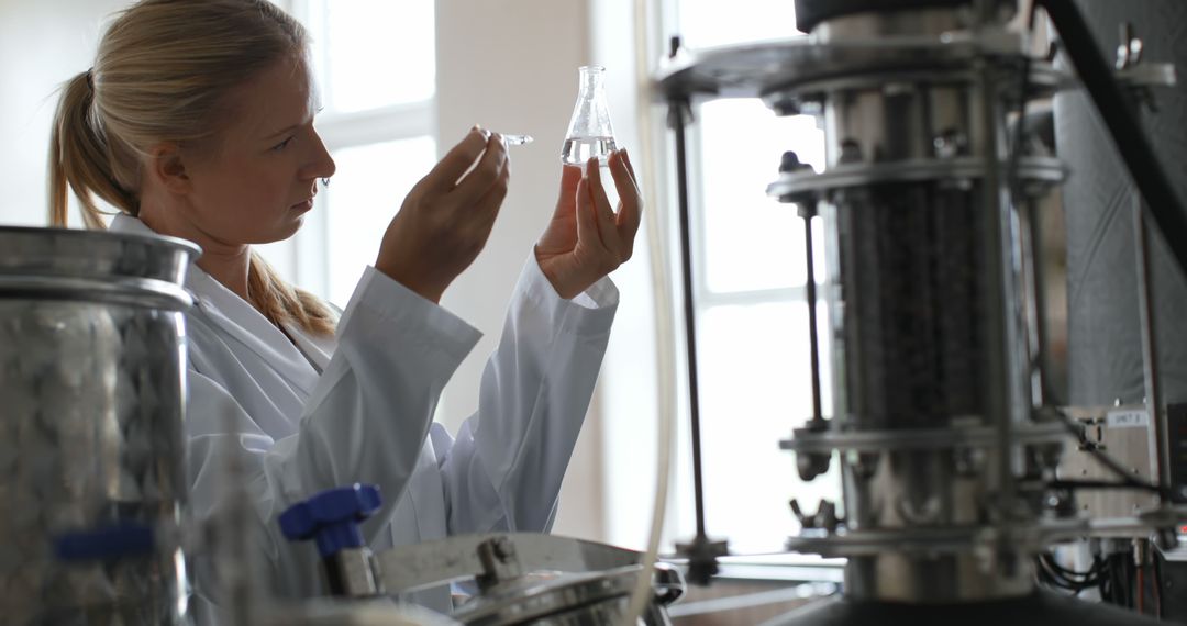 Female Scientist Analyzing Liquid in Laboratory - Free Images, Stock Photos and Pictures on Pikwizard.com