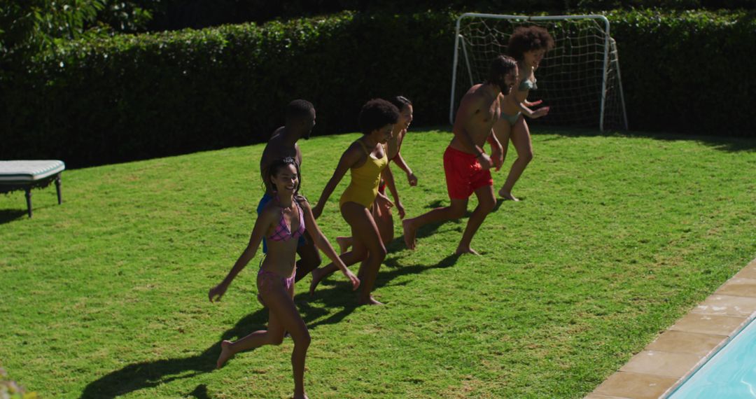 Group of Friends Running Towards Pool on Sunny Day - Free Images, Stock Photos and Pictures on Pikwizard.com