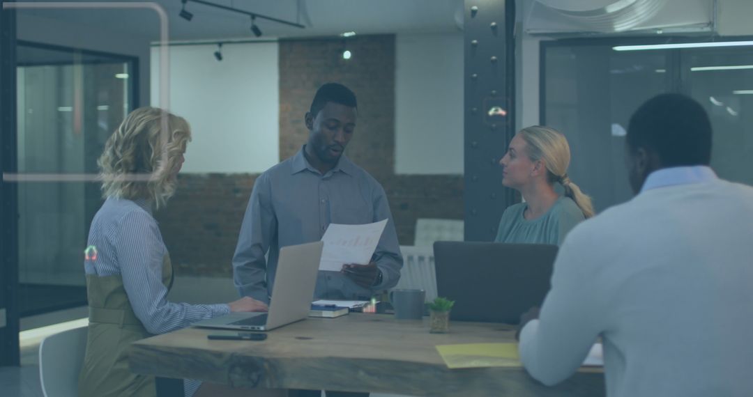 Diverse Team Analyzing Reports with Digital Overlay