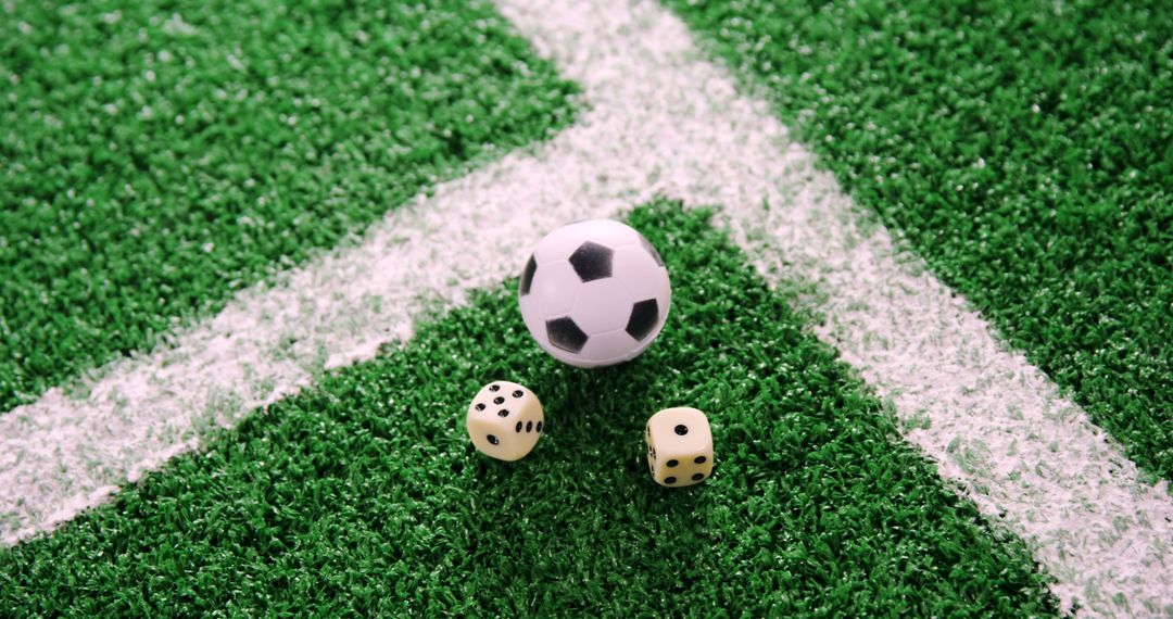 Mini Soccer Ball and Two Dice on Green Turf Near White Line - Free Images, Stock Photos and Pictures on Pikwizard.com