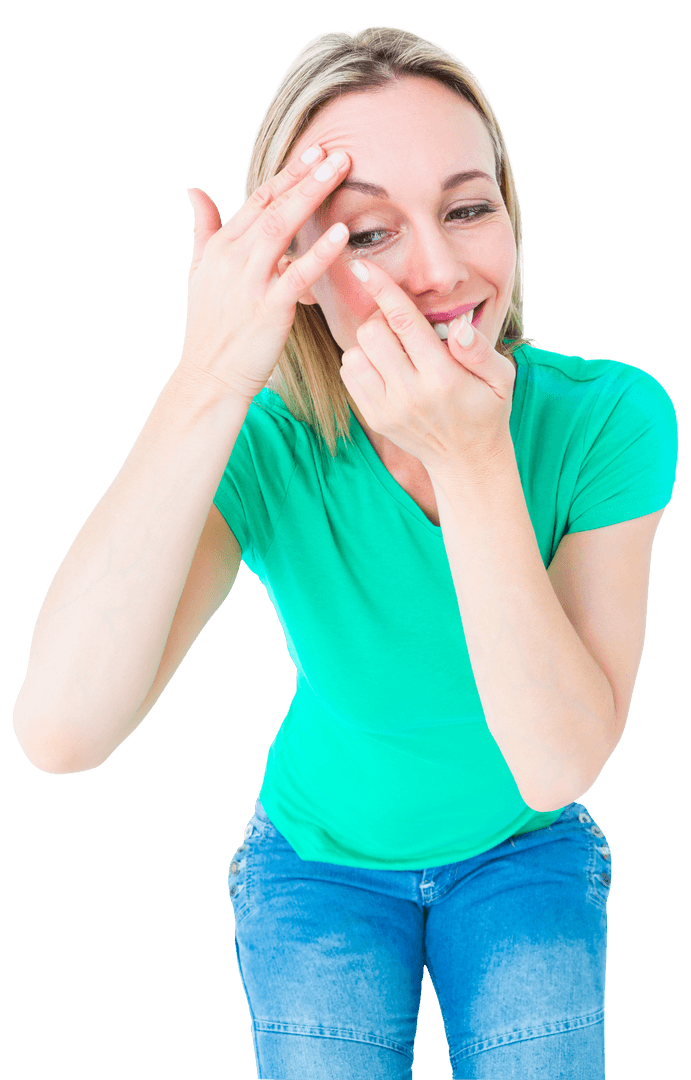 Smiling Woman in Green Shirt Applying Transparent Contact Lens