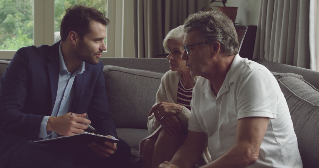 Young Advisor Discussing Financial Planning with Senior Couple
