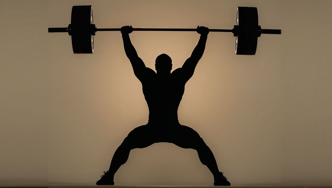 Silhouette Weightlifter Performing Overhead Snatch with Halo Backlight and Power Pose