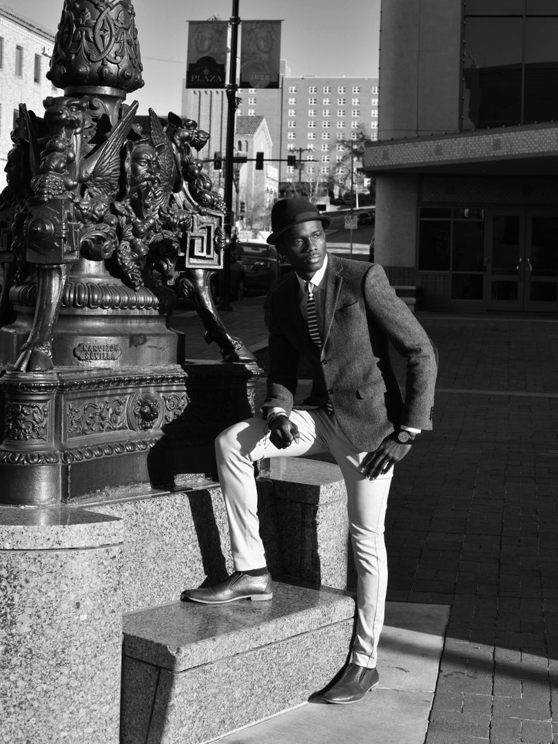 Stylish Man Posing on Urban Street with Historical Monument - Free Images, Stock Photos and Pictures on Pikwizard.com