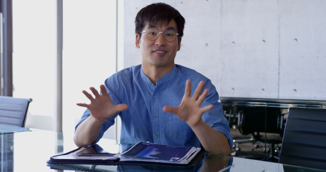 Confident Businessman Presenting at Work Meeting