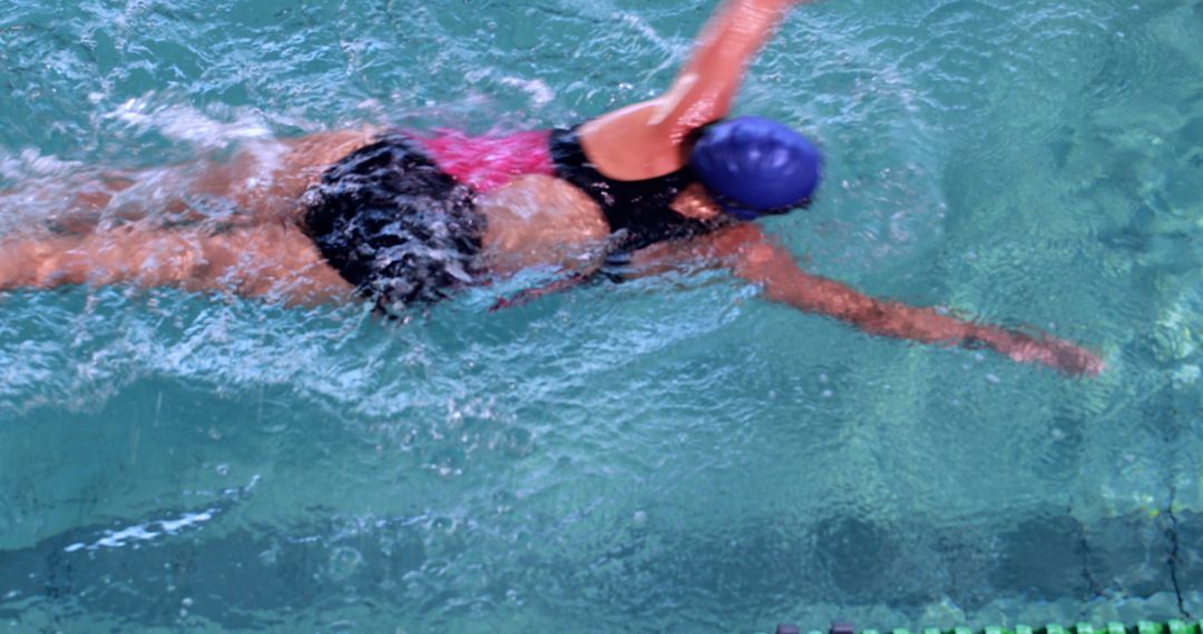 Woman Swimming in the Pool Wearing Swim Cap - Free Images, Stock Photos and Pictures on Pikwizard.com