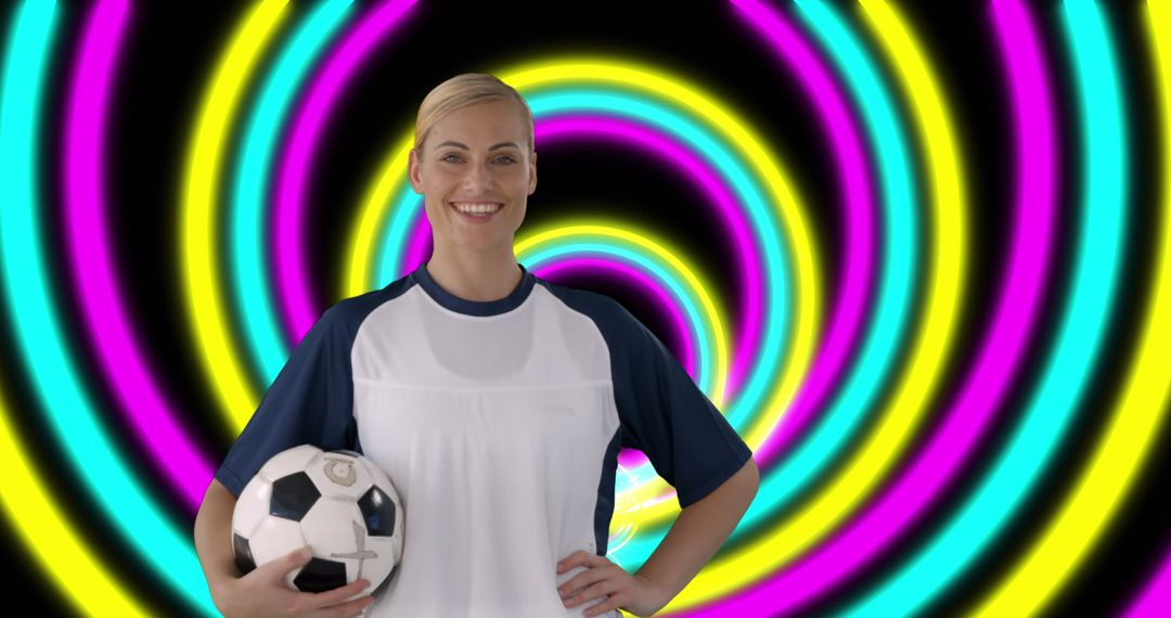 Smiling Female Soccer Player Holding Ball with Abstract Neon Background - Free Images, Stock Photos and Pictures on Pikwizard.com