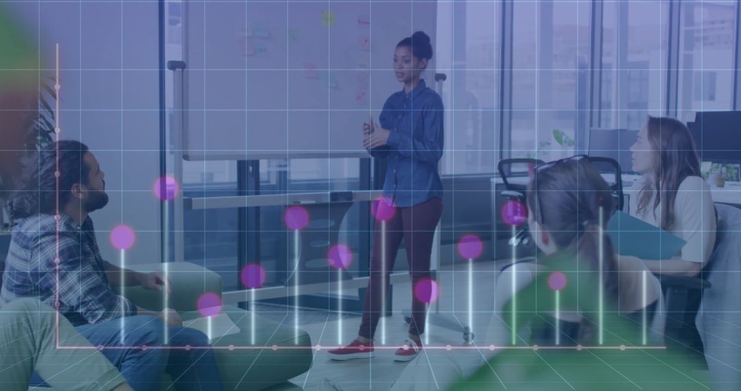 Creative Team Discussing Digital Graph in Modern Office Environment