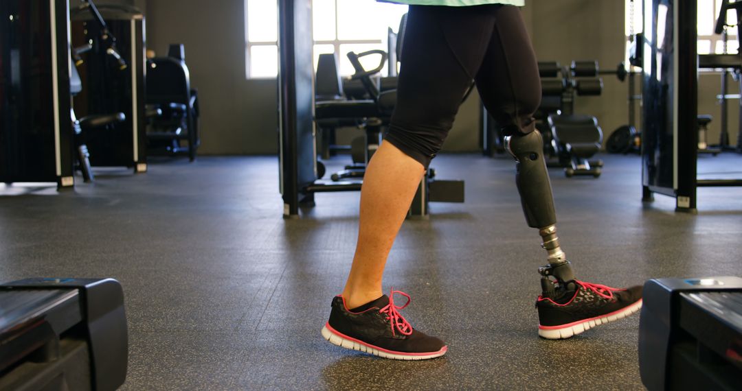 Person with Prosthetic Leg Walking in Gym - Free Images, Stock Photos and Pictures on Pikwizard.com