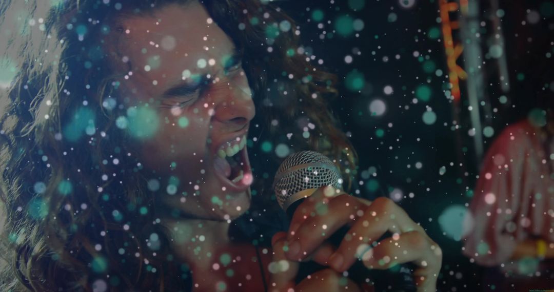 Energetic Lead Vocalist Singing on Vibrant Concert Stage