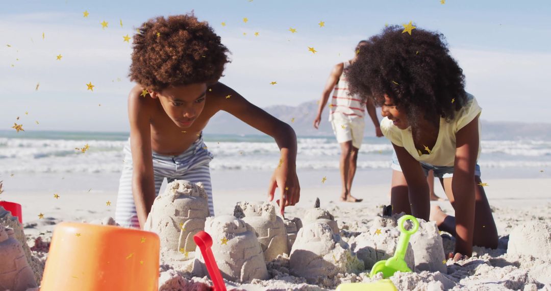 Children Building Sandcastles on Sandy Beach with Family