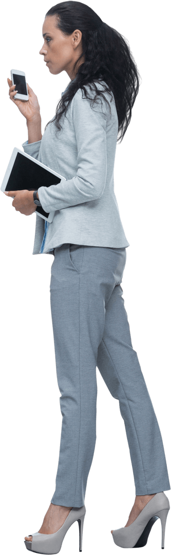 Elegant Businesswoman Holding Digital Tablet and Phone on Transparent Background