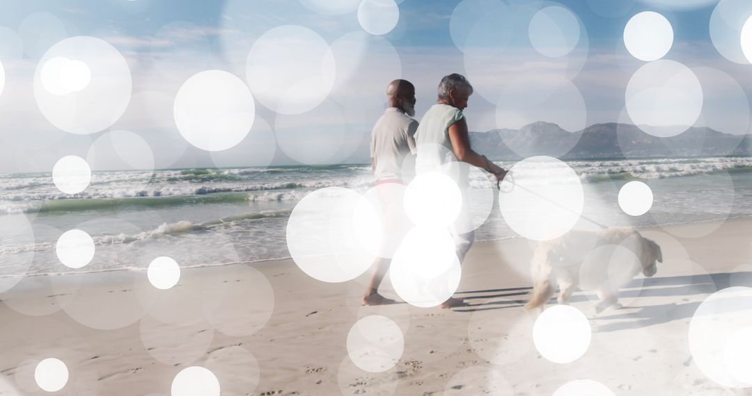 Senior Couple Strolling with Dog on Ocean Shoreline