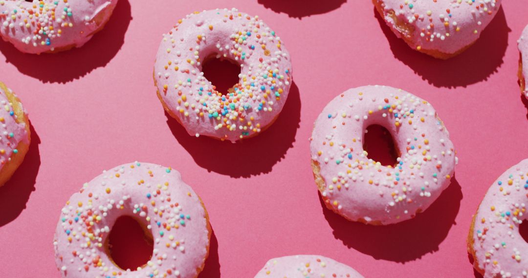 Pink Glazed Donuts with Sprinkles on Pink Background - Free Images, Stock Photos and Pictures on Pikwizard.com