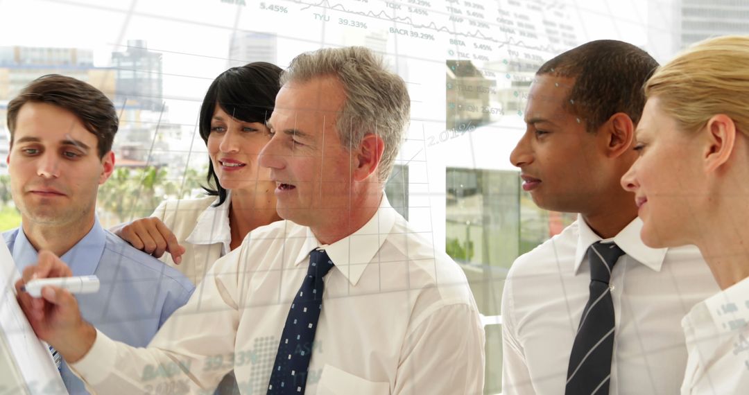 Diverse Business Team Analyzing Financial Data Charts in Office