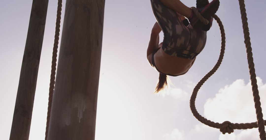 Fit Woman Climbing Rope in Outdoor Workout - Free Images, Stock Photos and Pictures on Pikwizard.com