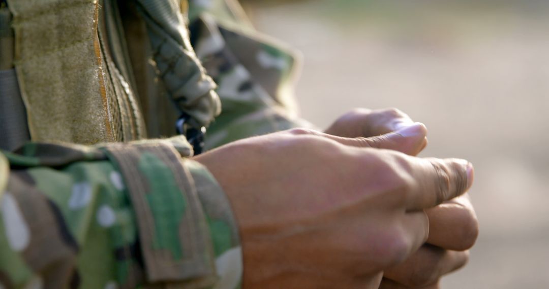 Close-Up View of Soldier in Camouflage with Rifle Magazine