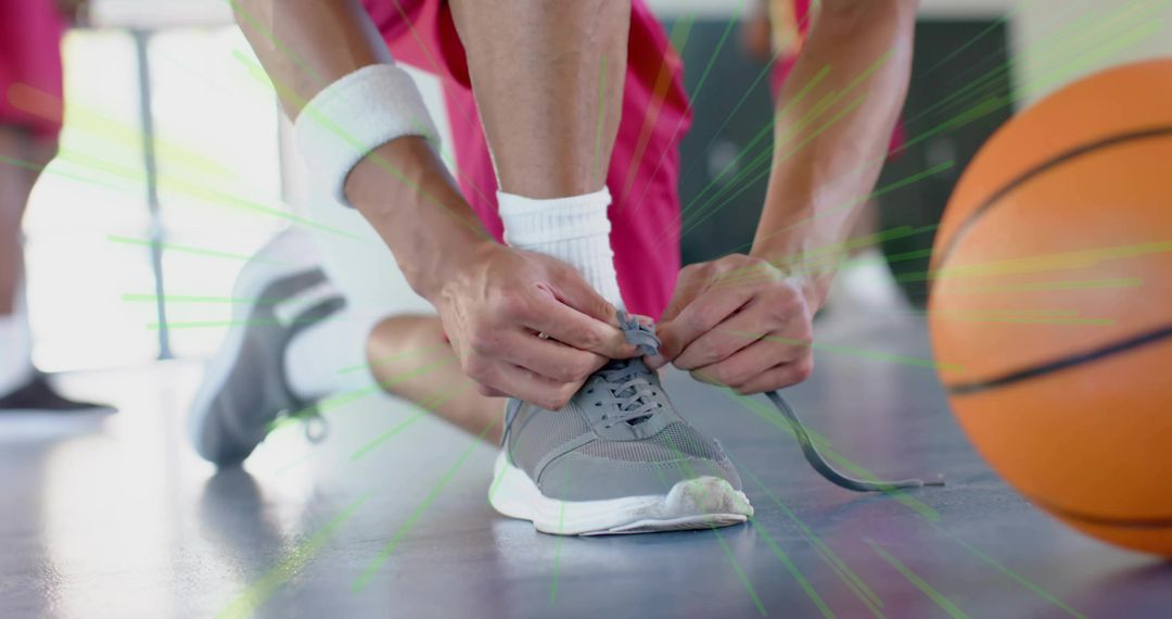 Basketball Player Tying Shoelaces on Court in Dynamic Pose