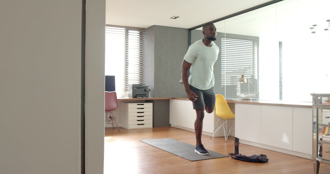 Man Practicing Balance Exercise in Modern Home Office