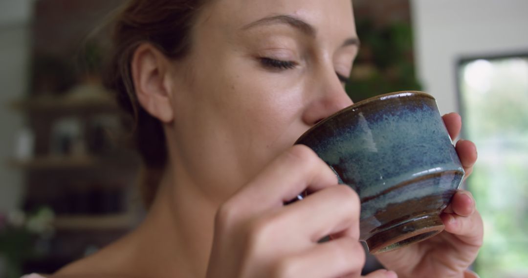 Woman Enjoying Coffee at Home - Free Images, Stock Photos and Pictures on Pikwizard.com