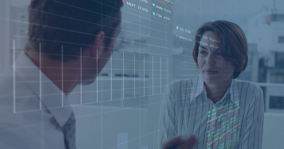 Business Professionals Analyzing Data on Transparent Interface at Office