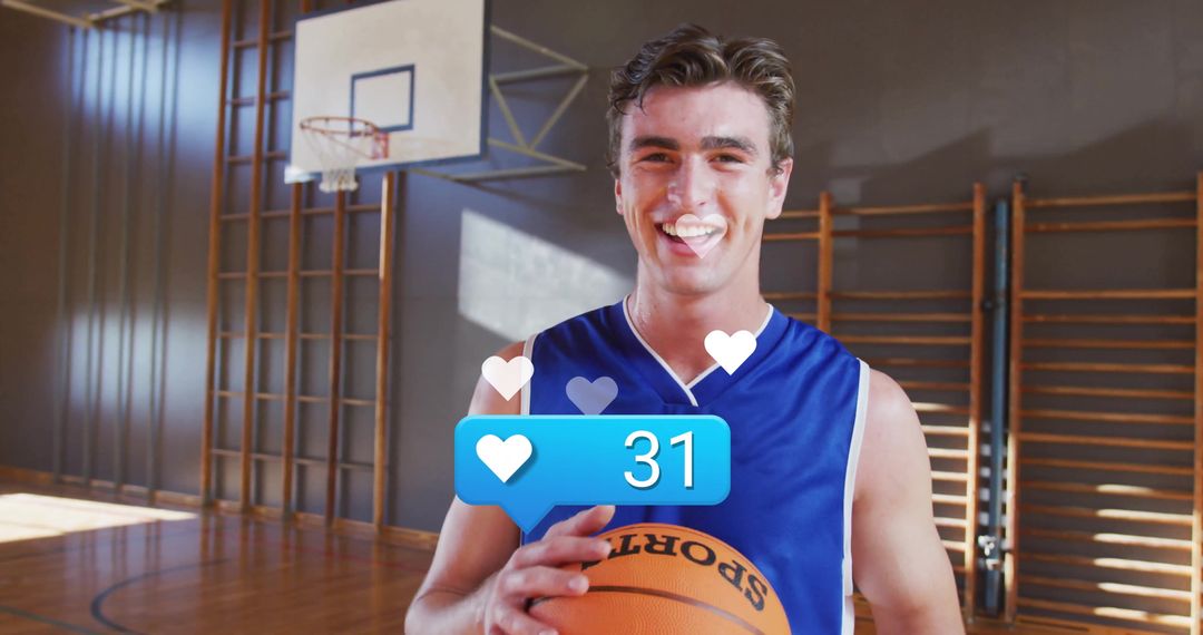 Smiling Basketball Player Holding Ball in Gymnasium